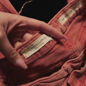 pink washed brand new high rise anthropologie jeans with a worn style